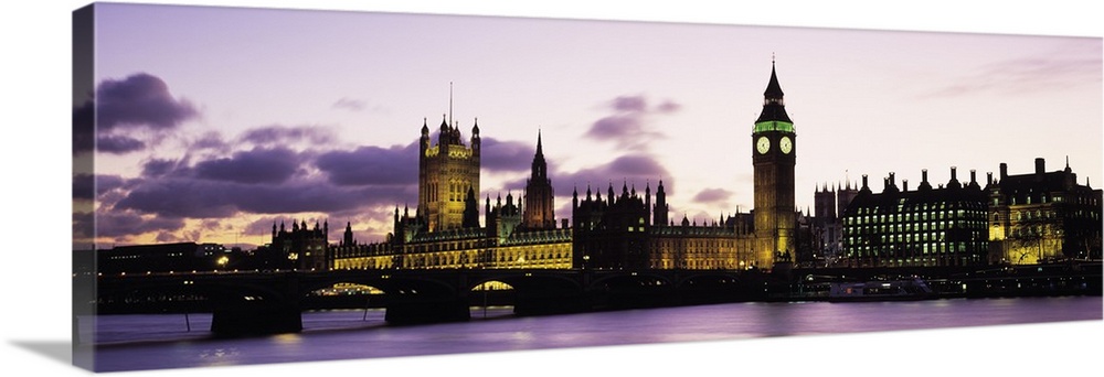 This is a panoramic photograph taken from the opposite shore of the river showcasing famous landmarks in the city.