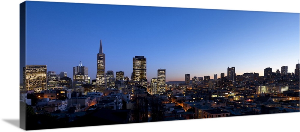 Buildings lit up at dusk, Telegraph Hill, San Francisco, California