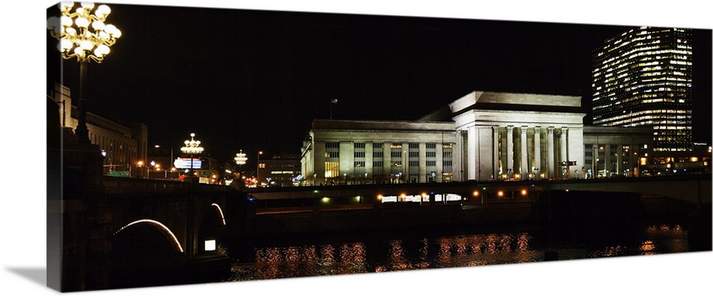 Buildings lit up at night at a railroad station, 30th Street Station, Schuylkill River, Philadelphia, Pennsylvania