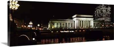 Buildings lit up at night at a railroad station, 30th Street Station, Schuylkill River, Philadelphia, Pennsylvania