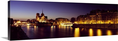 Buildings lit up at night, Notre Dame, Seine River, Paris, Ile-De-France, France
