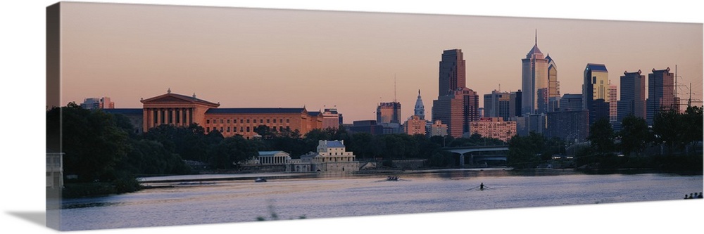 Panoramic style picture of downtown Philadelphia with rowers working out on the Schuylkill River.