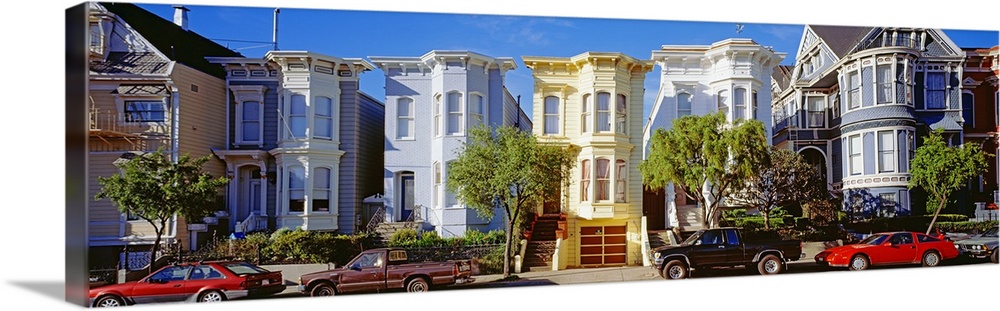 Cars parked in front of Victorian houses, San Francisco, California