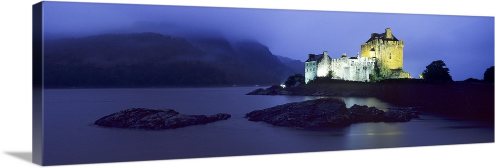 Castle lit up at dusk, Eilean Donan Castle, Loch Duich, Dornie, Highlands Region, Scotland
