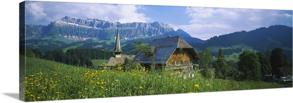 Chalet and a church on a landscape, Emmental, Switzerland