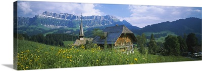 Chalet and a church on a landscape, Emmental, Switzerland