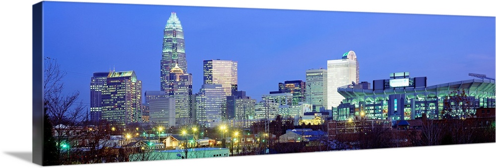 Panoramic cityscape photograph of the Queen City downtown at twilight.