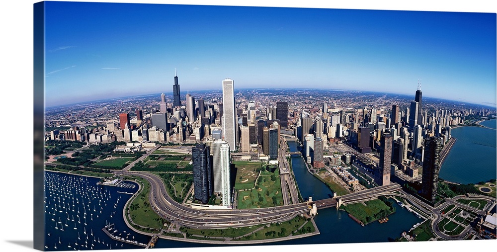 Giant panoramic photo of downtown Chicago, Illinois (IL). Skyscrapers and boats in Lake Michigan are visible.