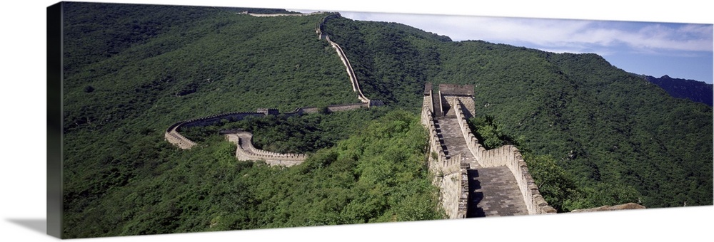 Panoramic view of the Great Wall of China which spans over 4,000 miles, making it the longest man-made structure ever built.