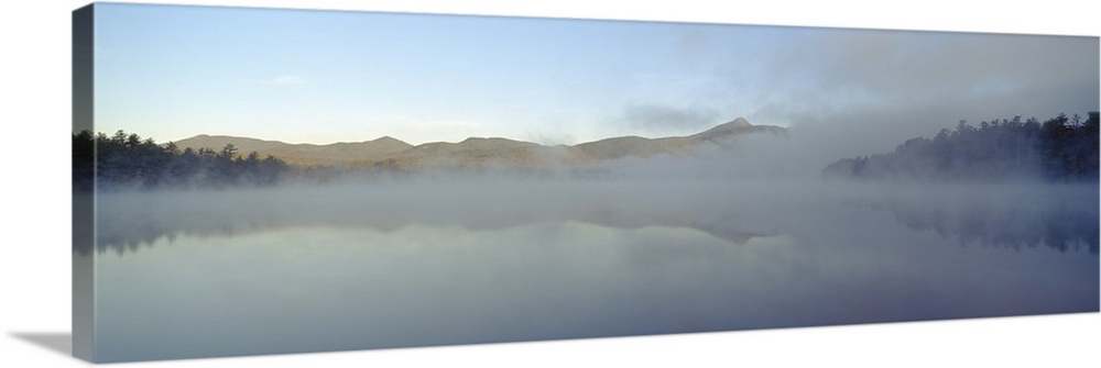 Wall art for the home or office this panoramic photograph shows mist rising off a New England lake.