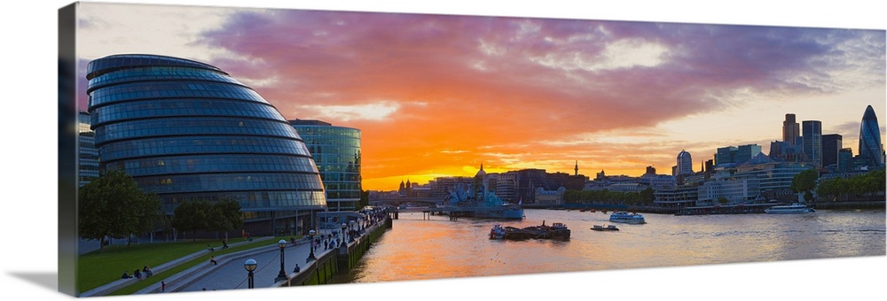 City hall with office buildings at sunset Thames River London England