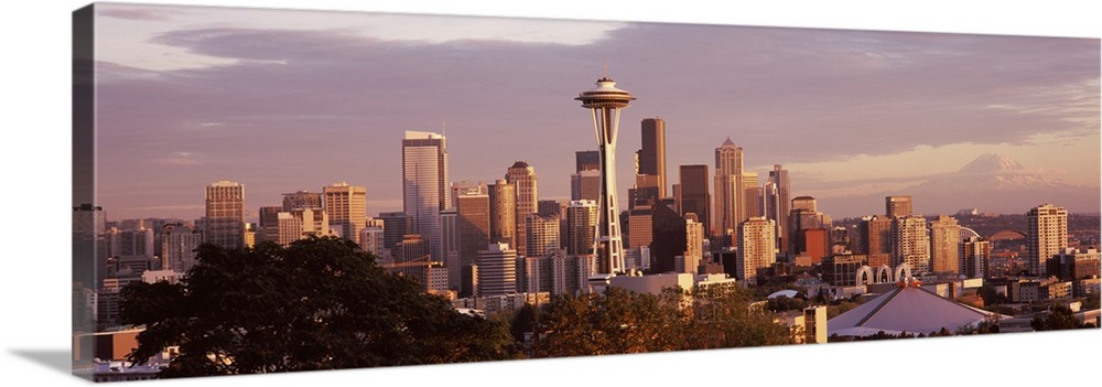 Big horizontal photograph the Seattle skyline, including the Space Needle, taken from Queen Anne Hill, a cloudy sky in the...