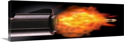 Close-up of a gun firing a bullet