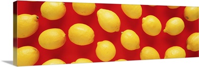Close-up of lemons on a red background