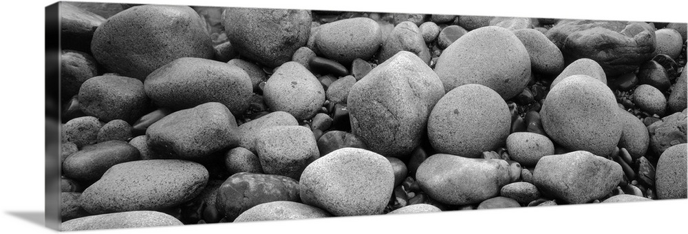 Panoramic canvas zoomed in on round and smooth rocks.