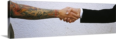 Close Up Of Two Men Shaking Hands, Germany