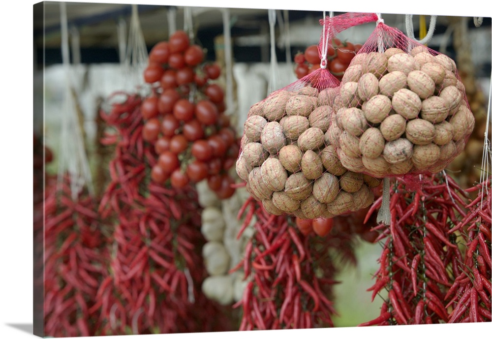 Close-up of walnuts and red chili peppers hanging in a store, Positano, Amalfi Coast, Campania, Italy