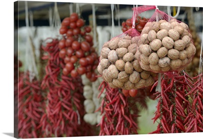 Close-up of walnuts and red chili peppers hanging in a store, Positano, Amalfi Coast, Campania, Italy