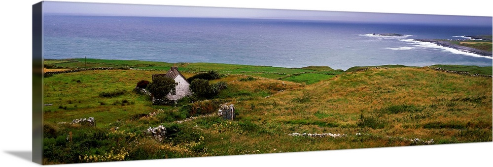 Coastal landscape with white stone house, Galway Bay, The Burren region, Ireland