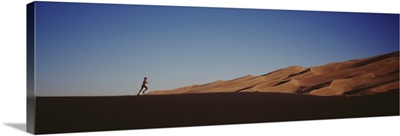 Colorado, Great Sand Dunes National Monument, Runner jogging in the park