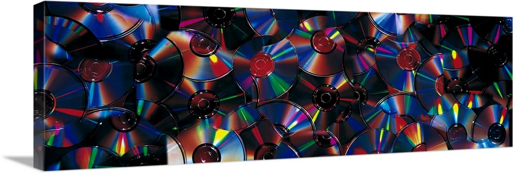 Panoramic piece of a collage that consists of CDs.
