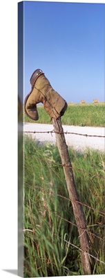 Cowboy boot on a fence, Pottawatomie County, Kansas