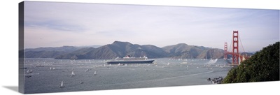 Cruise ship approaching a suspension bridge, RMS Queen Mary 2, Golden Gate Bridge, San Francisco, California