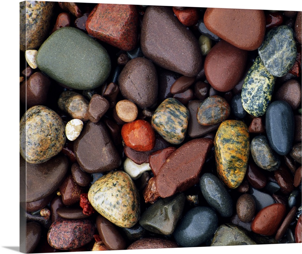 Photograph of collage of rocks varying in color, size, and shape.   Some of the rocks are smoothed, some are rough texture...