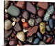 image thumbnail of Photograph of collage of rocks varying in color, size, and shape.   Some of the rocks are smoothed, some are rough texture...