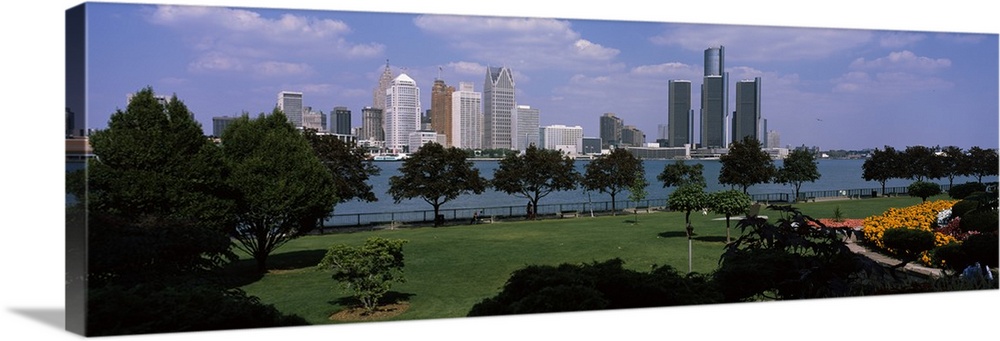This wall art is a panoramic photograph of the city skyline taken from a park across the water.
