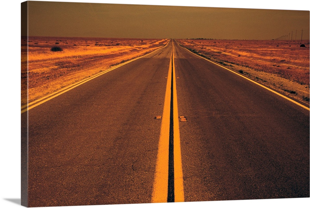 Distance view of empty road in desert at evening