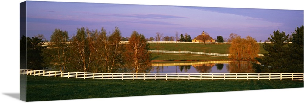 Panoramic photograph of a horse farm and pond in Kentucky available as wall art for the home or office.