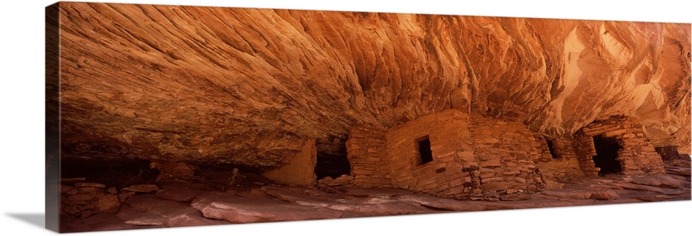 Panoramic wall art of ancient houses in the side of a cliff in Utah.