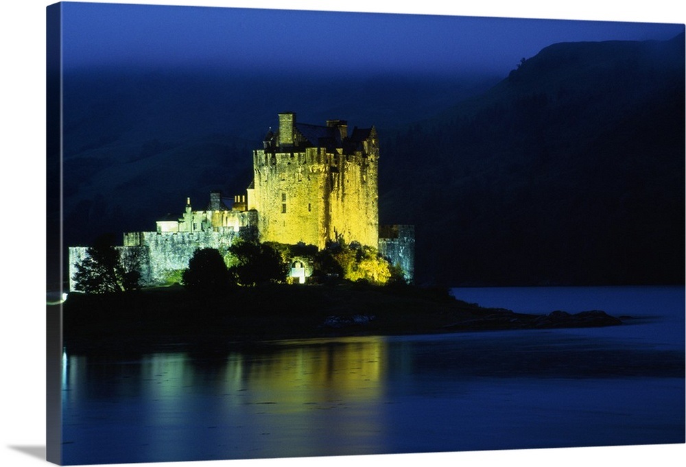 Eilean Donan Castle illuminated at night, water reflection, Conchra