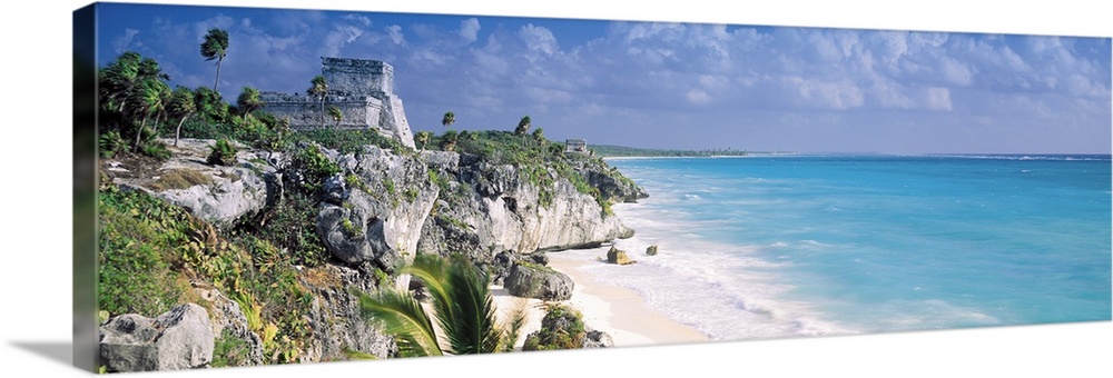 Cliffs that line the ocean coast in Mexico are photographed in panoramic view.