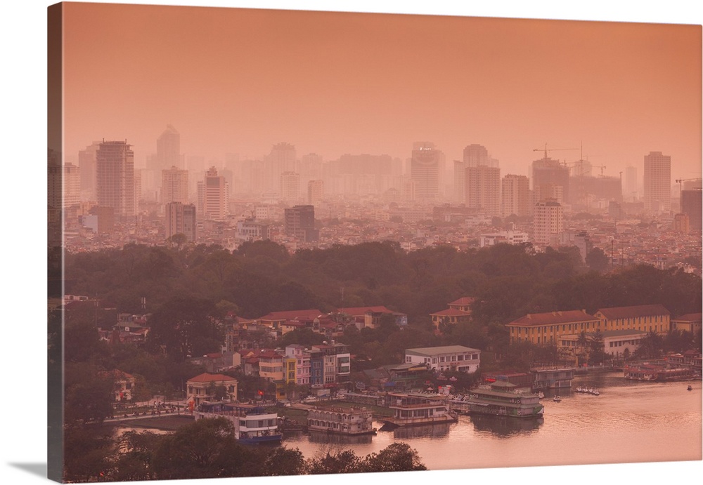 Elevated view of a lake and a city at sunset, west lake, tay ho, hanoi, vietnam.