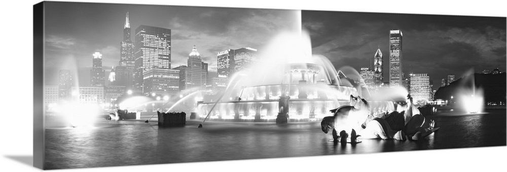 Horizontal canvas of a big water fountain in Illinois with downtown building in the background.