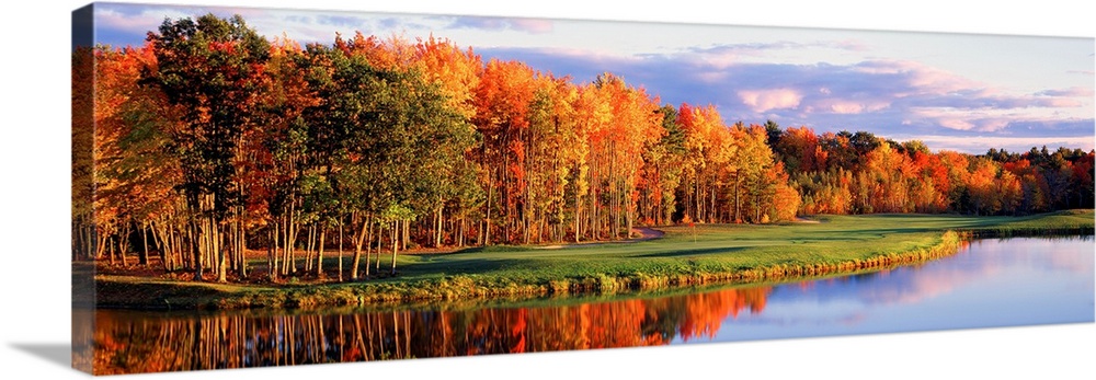 Panoramic wall art, photograph of autumn trees reflecting in still waters.