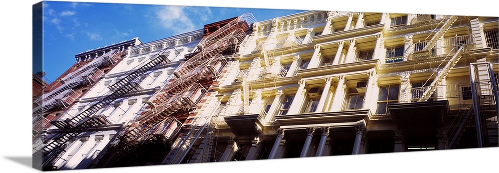 Up-close panoramic photograph of row houses in The Big Apple.