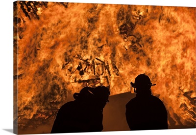 Firemen controlling flames, Fourth Of July Bonfire, Rockport, Cape Ann, Massachusetts