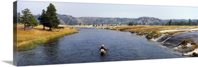 Fisherman fishing in a river, Firehole River, Yellowstone National Park, Wyoming