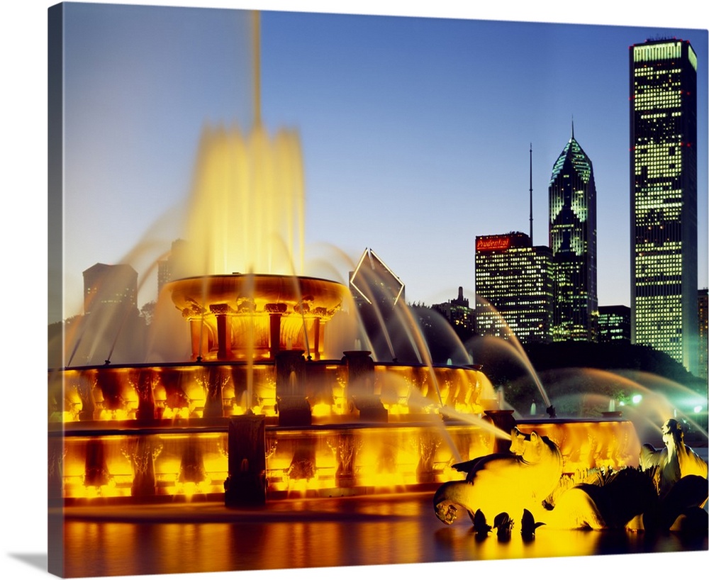 Fountain in a city lit up at dusk, Chicago, Illinois