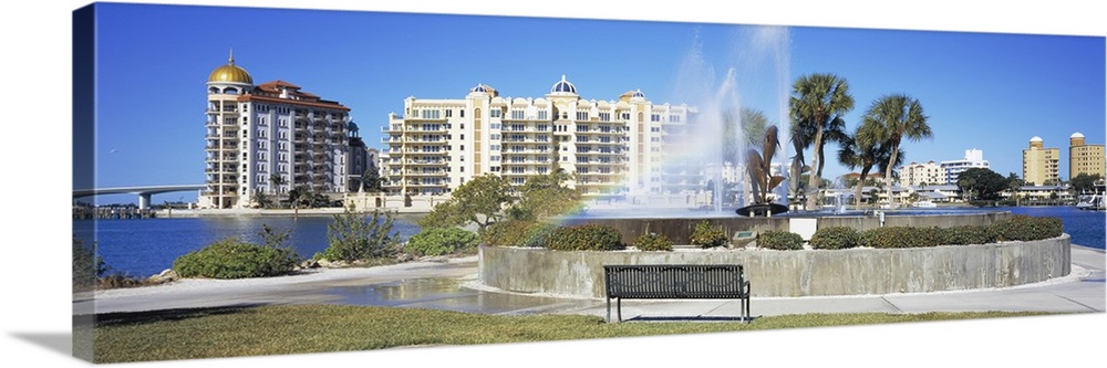 Fountain in a park with building in the background, Golden Gate Point, Bayfront Park, Sarasota Bay, Sarasota, Florida