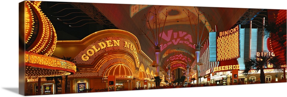 This panoramic wall art is a photograph of the neon glitz and shine of the cityos casinos.