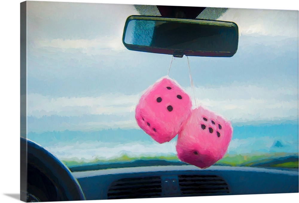 Furry dice hanging in a car