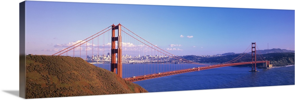 Panoramic photo on canvas of the Golden Gate Bridge spanning from left to right with the city in the background.