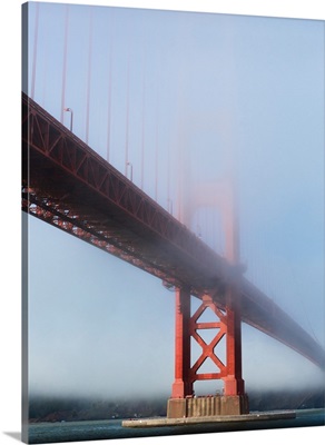 Golden Gate suspension bridge covered with fog, San Francisco