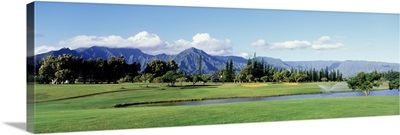 Golf course in front of mountains, Princeville, Kauai, Hawaii