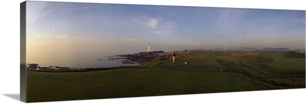 Golf course with a lighthouse in the background, Turnberry, South Ayrshire, Scotland