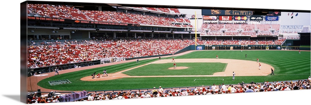 Long horizontal image of a baseball game being played as spectators watch in Ohio.